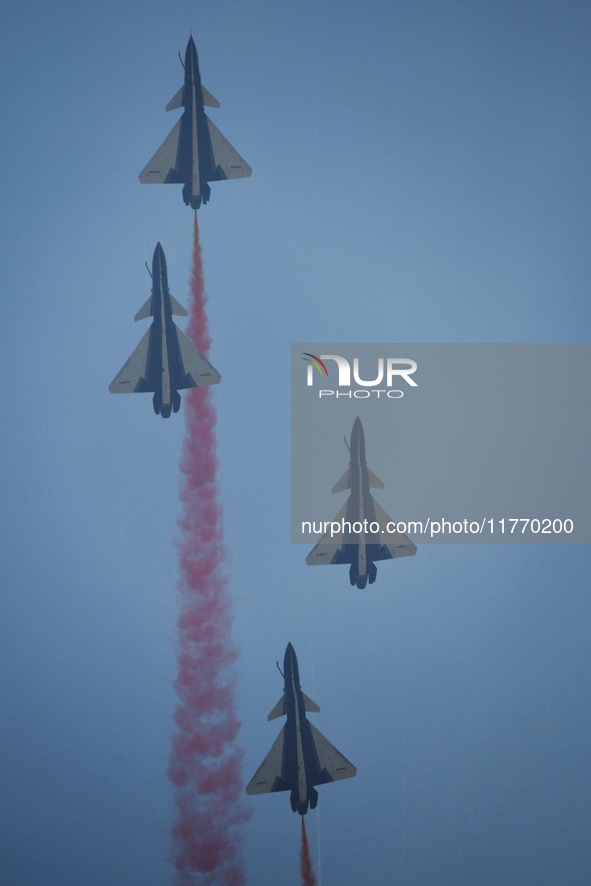 The ''August 1'' aerobatic team of the Chinese Air Force flies a J-10C during a demonstration at the 2024 Zhuhai Air Show in Zhuhai, China,...