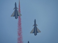 The ''August 1'' aerobatic team of the Chinese Air Force flies a J-10C during a demonstration at the 2024 Zhuhai Air Show in Zhuhai, China,...