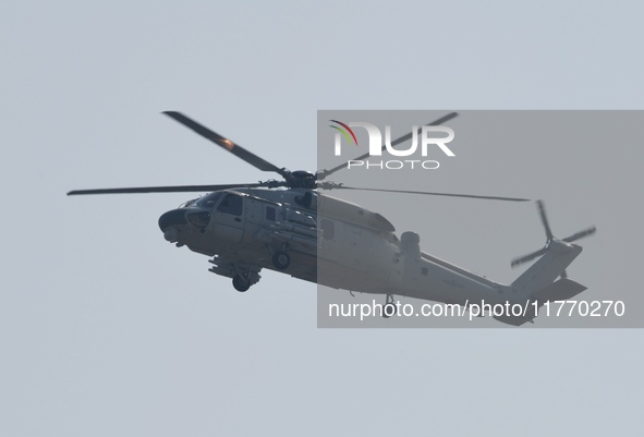 A Chinese Navy ship-borne helicopter Z-20 performs a flight demonstration at the Zhuhai Air Show in Zhuhai, Guangdong province, China, on No...