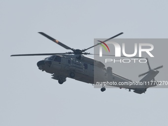 A Chinese Navy ship-borne helicopter Z-20 performs a flight demonstration at the Zhuhai Air Show in Zhuhai, Guangdong province, China, on No...