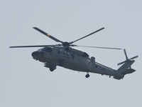 A Chinese Navy ship-borne helicopter Z-20 performs a flight demonstration at the Zhuhai Air Show in Zhuhai, Guangdong province, China, on No...