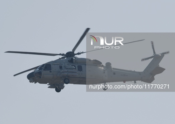 A Chinese Navy ship-borne helicopter Z-20 performs a flight demonstration at the Zhuhai Air Show in Zhuhai, Guangdong province, China, on No...