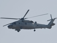 A Chinese Navy ship-borne helicopter Z-20 performs a flight demonstration at the Zhuhai Air Show in Zhuhai, Guangdong province, China, on No...