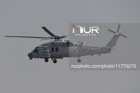 A Chinese Navy ship-borne helicopter Z-20 performs a flight demonstration at the Zhuhai Air Show in Zhuhai, Guangdong province, China, on No...