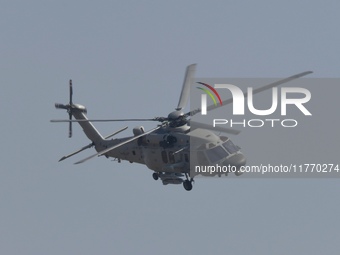 A Chinese Navy ship-borne helicopter Z-20 performs a flight demonstration at the Zhuhai Air Show in Zhuhai, Guangdong province, China, on No...