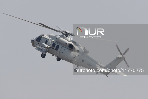 A Chinese Navy ship-borne helicopter Z-20 performs a flight demonstration at the Zhuhai Air Show in Zhuhai, Guangdong province, China, on No...