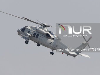 A Chinese Navy ship-borne helicopter Z-20 performs a flight demonstration at the Zhuhai Air Show in Zhuhai, Guangdong province, China, on No...