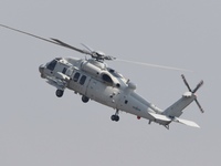 A Chinese Navy ship-borne helicopter Z-20 performs a flight demonstration at the Zhuhai Air Show in Zhuhai, Guangdong province, China, on No...