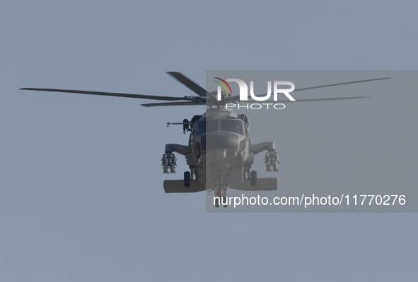 A Chinese Navy ship-borne helicopter Z-20 performs a flight demonstration at the Zhuhai Air Show in Zhuhai, Guangdong province, China, on No...