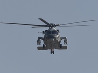 A Chinese Navy ship-borne helicopter Z-20 performs a flight demonstration at the Zhuhai Air Show in Zhuhai, Guangdong province, China, on No...