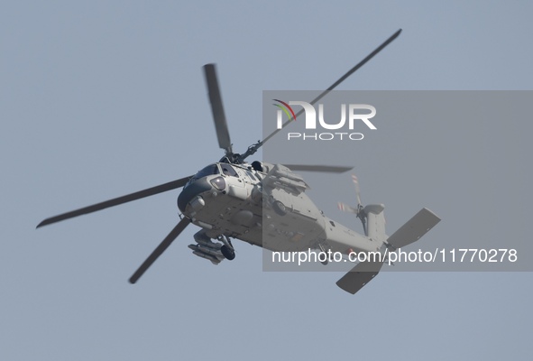 A Chinese Navy ship-borne helicopter Z-20 performs a flight demonstration at the Zhuhai Air Show in Zhuhai, Guangdong province, China, on No...