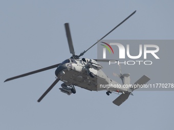 A Chinese Navy ship-borne helicopter Z-20 performs a flight demonstration at the Zhuhai Air Show in Zhuhai, Guangdong province, China, on No...