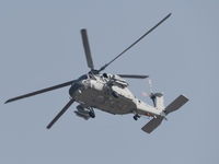 A Chinese Navy ship-borne helicopter Z-20 performs a flight demonstration at the Zhuhai Air Show in Zhuhai, Guangdong province, China, on No...