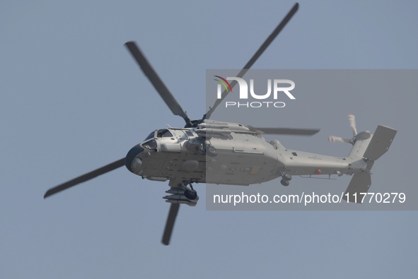 A Chinese Navy ship-borne helicopter Z-20 performs a flight demonstration at the Zhuhai Air Show in Zhuhai, Guangdong province, China, on No...