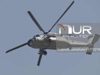 A Chinese Navy ship-borne helicopter Z-20 performs a flight demonstration at the Zhuhai Air Show in Zhuhai, Guangdong province, China, on No...