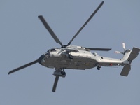 A Chinese Navy ship-borne helicopter Z-20 performs a flight demonstration at the Zhuhai Air Show in Zhuhai, Guangdong province, China, on No...