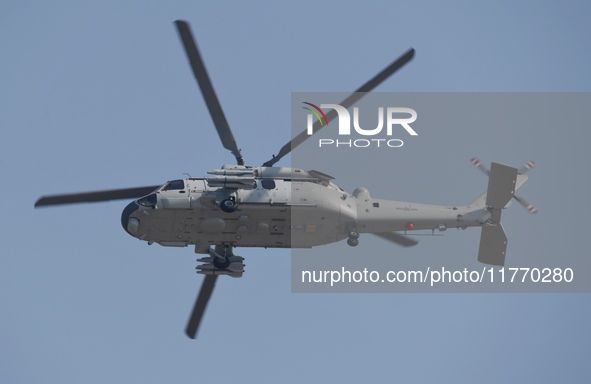 A Chinese Navy ship-borne helicopter Z-20 performs a flight demonstration at the Zhuhai Air Show in Zhuhai, Guangdong province, China, on No...