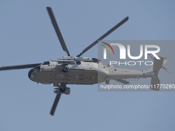 A Chinese Navy ship-borne helicopter Z-20 performs a flight demonstration at the Zhuhai Air Show in Zhuhai, Guangdong province, China, on No...