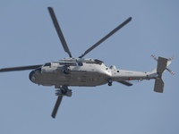 A Chinese Navy ship-borne helicopter Z-20 performs a flight demonstration at the Zhuhai Air Show in Zhuhai, Guangdong province, China, on No...