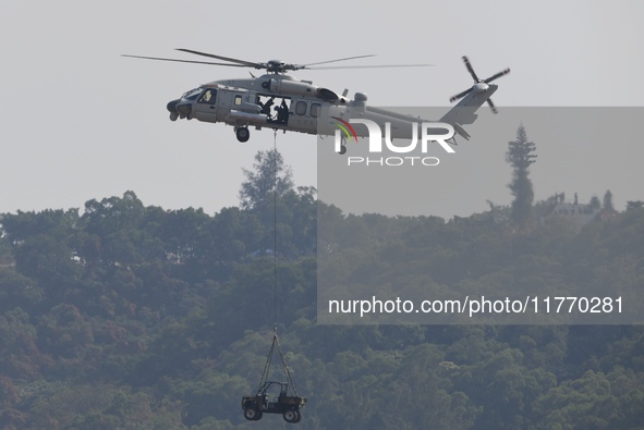 A Chinese Navy ship-borne helicopter Z-20 performs a flight demonstration at the Zhuhai Air Show in Zhuhai, Guangdong province, China, on No...