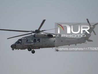 A Chinese Navy ship-borne helicopter Z-20 performs a flight demonstration at the Zhuhai Air Show in Zhuhai, Guangdong province, China, on No...