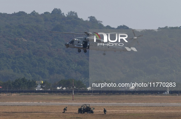 A Chinese Navy ship-borne helicopter Z-20 performs a flight demonstration at the Zhuhai Air Show in Zhuhai, Guangdong province, China, on No...