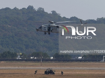 A Chinese Navy ship-borne helicopter Z-20 performs a flight demonstration at the Zhuhai Air Show in Zhuhai, Guangdong province, China, on No...