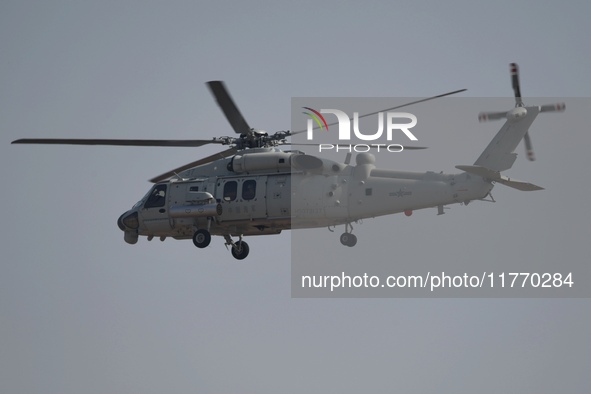 A Chinese Navy ship-borne helicopter Z-20 performs a flight demonstration at the Zhuhai Air Show in Zhuhai, Guangdong province, China, on No...