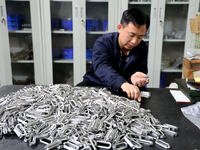 A worker produces metal parts at a workshop of a precision machinery manufacturing enterprise in Binzhou, China, on November 12, 2024. (