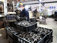 A worker produces metal parts at a workshop of a precision machinery manufacturing enterprise in Binzhou, China, on November 12, 2024. (