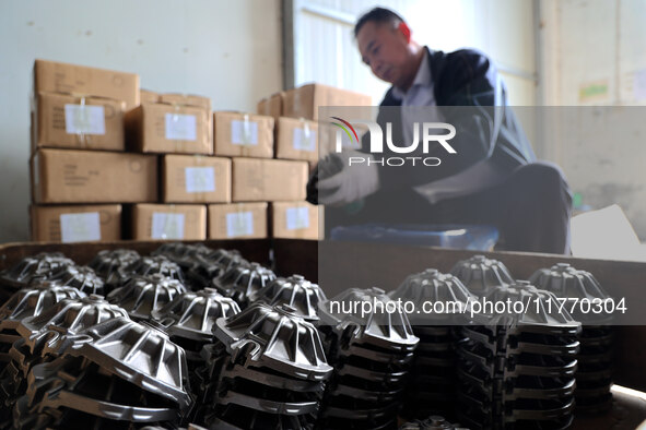 A worker produces metal parts at a workshop of a precision machinery manufacturing enterprise in Binzhou, China, on November 12, 2024. 