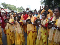 People participate in a protest rally against the attacks on Hindu minorities in neighboring Bangladesh, currently under the rule of an inte...