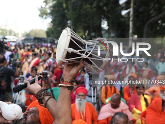 People participate in a protest rally against the attacks on Hindu minorities in neighboring Bangladesh, currently under the rule of an inte...