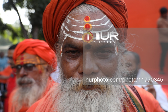 People participate in a protest rally against the attacks on Hindu minorities in neighboring Bangladesh, currently under the rule of an inte...