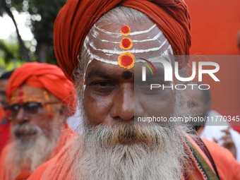 People participate in a protest rally against the attacks on Hindu minorities in neighboring Bangladesh, currently under the rule of an inte...