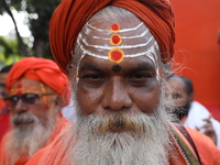 People participate in a protest rally against the attacks on Hindu minorities in neighboring Bangladesh, currently under the rule of an inte...