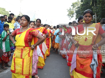 People participate in a protest rally against the attacks on Hindu minorities in neighboring Bangladesh, currently under the rule of an inte...