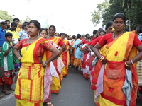 People participate in a protest rally against the attacks on Hindu minorities in neighboring Bangladesh, currently under the rule of an inte...