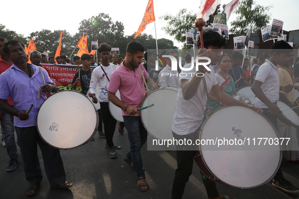 People participate in a protest rally against the attacks on Hindu minorities in neighboring Bangladesh, currently under the rule of an inte...