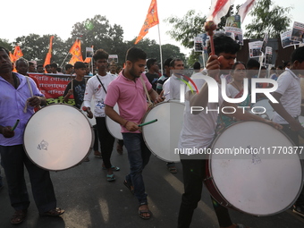 People participate in a protest rally against the attacks on Hindu minorities in neighboring Bangladesh, currently under the rule of an inte...