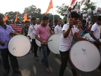 People participate in a protest rally against the attacks on Hindu minorities in neighboring Bangladesh, currently under the rule of an inte...