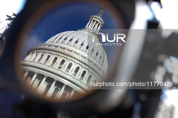 The dome of the U.S. Capitol buildling is seen reflected in a video camera lens before a GOP press conference on the steps of the U.S. Capit...