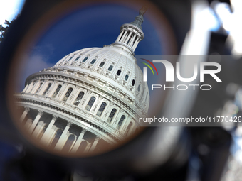 The dome of the U.S. Capitol buildling is seen reflected in a video camera lens before a GOP press conference on the steps of the U.S. Capit...