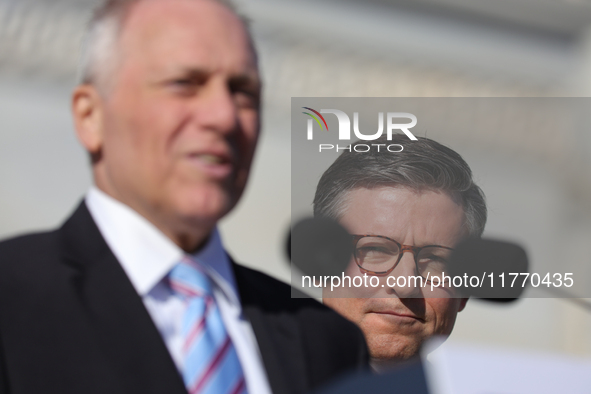 House Speaker Mike Johnson (R-LA), right, listens as Majority Leader Steve Scalise (R-LA) speaks at a GOP press conference on the steps of t...