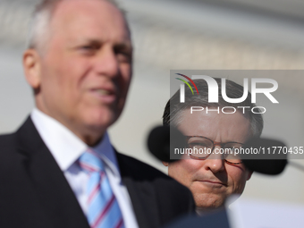 House Speaker Mike Johnson (R-LA), right, listens as Majority Leader Steve Scalise (R-LA) speaks at a GOP press conference on the steps of t...