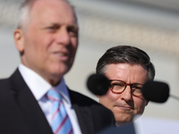 House Speaker Mike Johnson (R-LA), right, listens as Majority Leader Steve Scalise (R-LA) speaks at a GOP press conference on the steps of t...