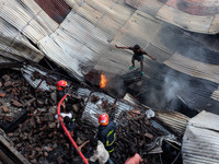 A local shoe factory is gutted due to a fire incident in Dhaka, Bangladesh, on November 12, 2024. (