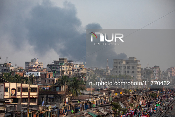 Smoke from the fire in the shoe factory is visible from a distance in Dhaka, Bangladesh, on November 12, 2024. 