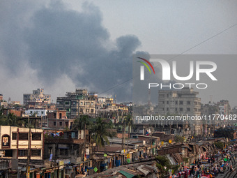 Smoke from the fire in the shoe factory is visible from a distance in Dhaka, Bangladesh, on November 12, 2024. (