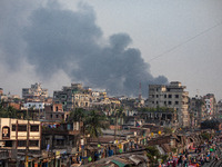 Smoke from the fire in the shoe factory is visible from a distance in Dhaka, Bangladesh, on November 12, 2024. (